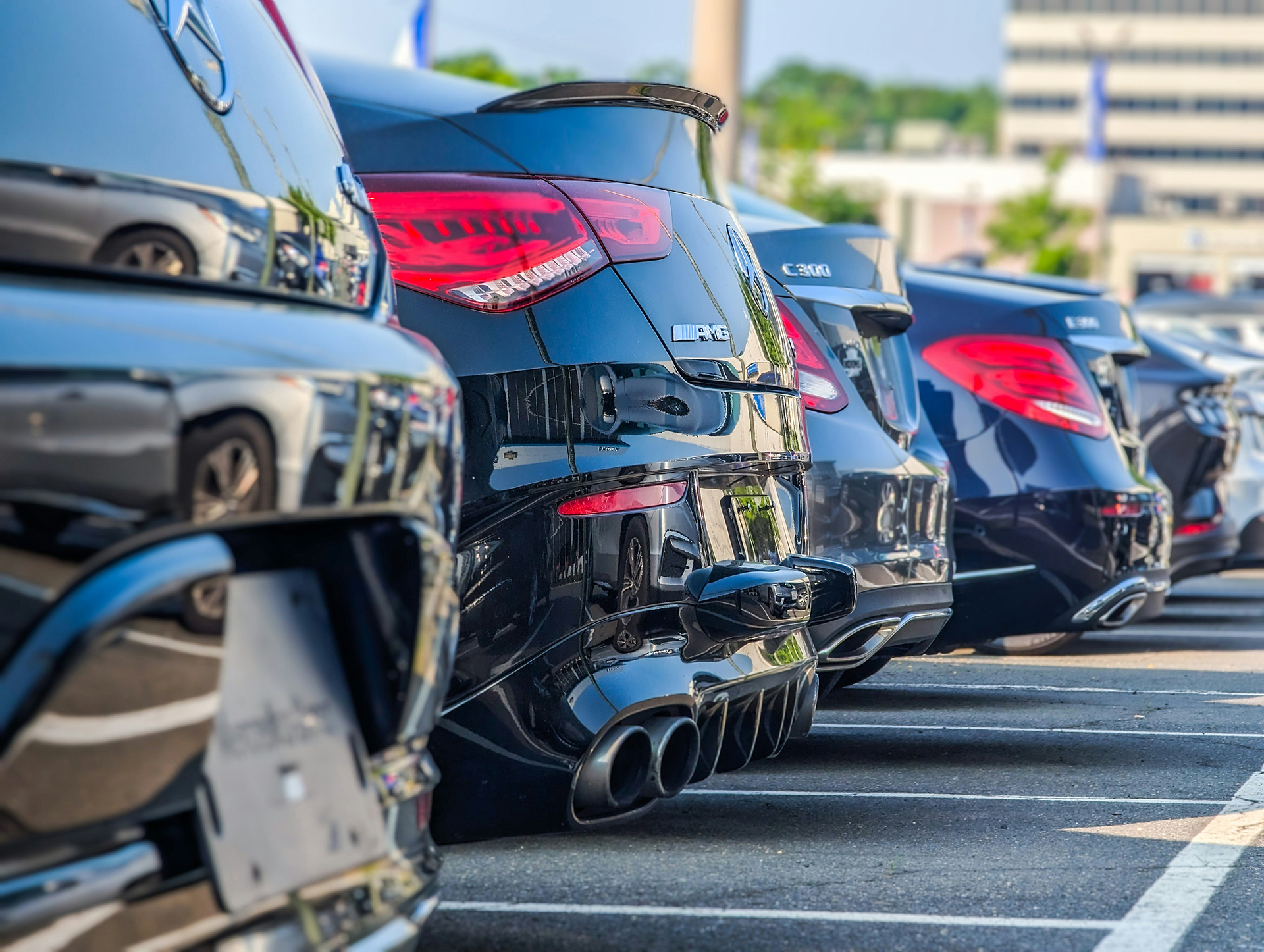Row of luxury vehicles at a dealership